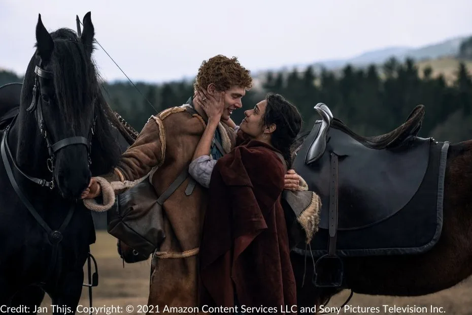 Egwene holds Rand’s face, smiling as they embrace beside their horses.